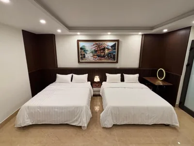 Chambre Queen avec deux lits Queen — Ruby's House